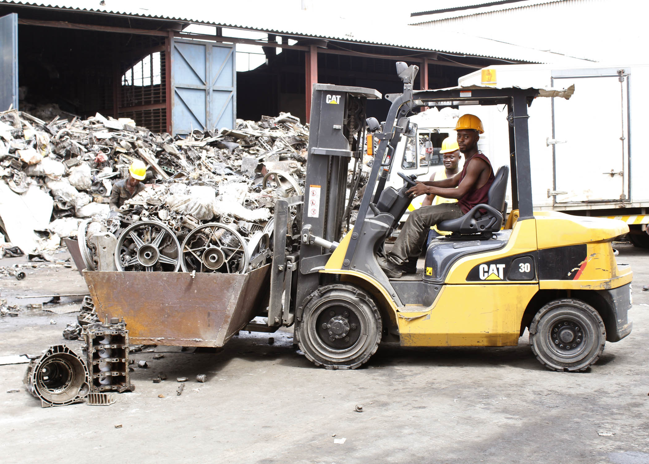 CAT forklift moving scrap